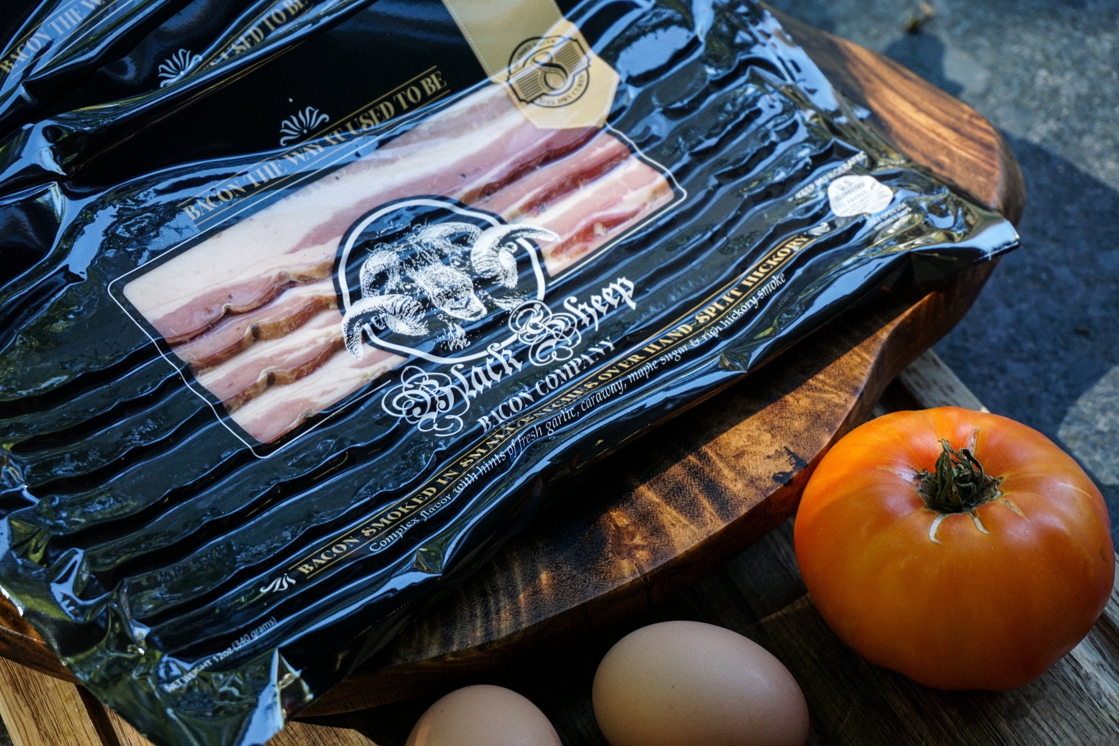 Packaged Black Sheep Bacon with tomato and farm fresh eggs